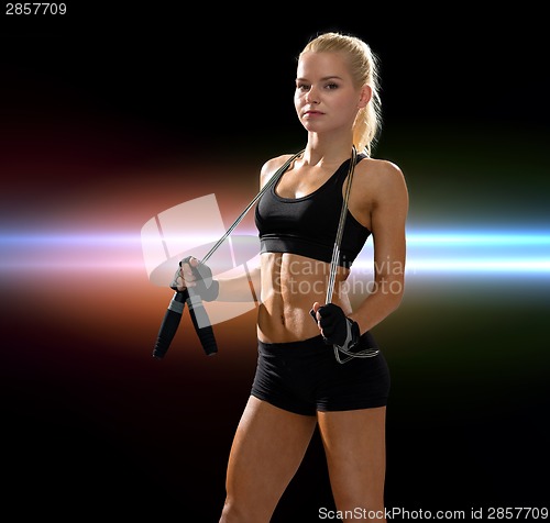 Image of sporty woman with skipping rope