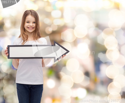 Image of smiling girl with blank arrow pointing right