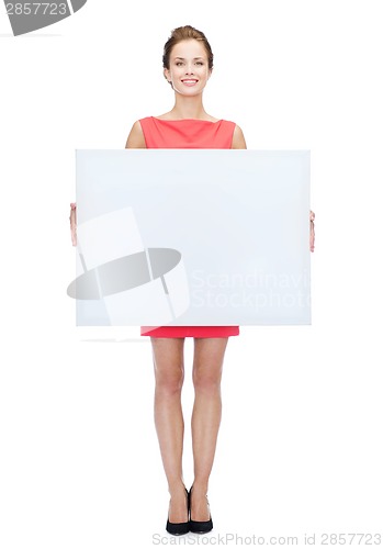 Image of smiling young woman with blank white board