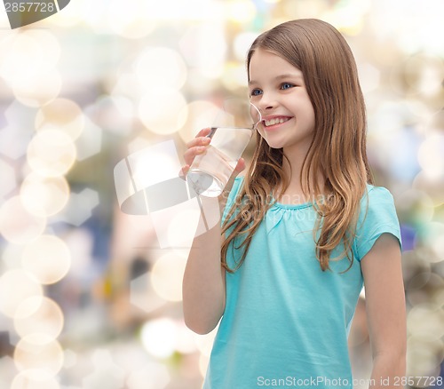 Image of smiling little girl with glass of water