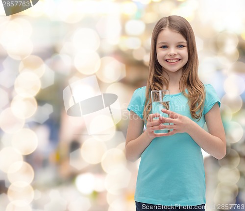 Image of smiling little girl with glass of water