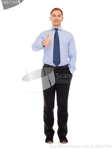 Image of smiling businessman showing thumbs up