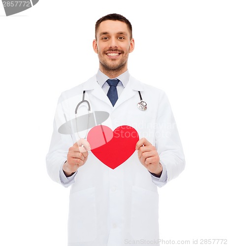 Image of smiling male doctor with red heart