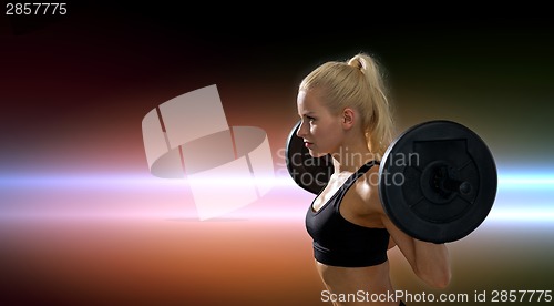 Image of sporty woman exercising with barbell