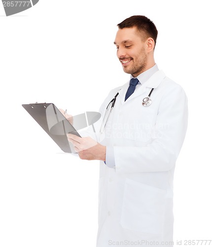 Image of smiling male doctor with clipboard and stethoscope