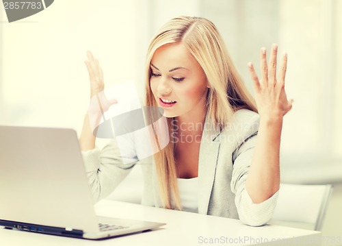 Image of angry woman with laptop