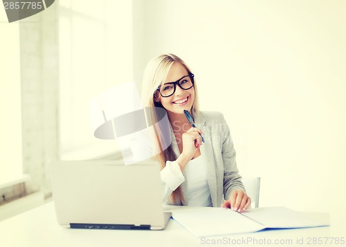 Image of businesswoman with documents