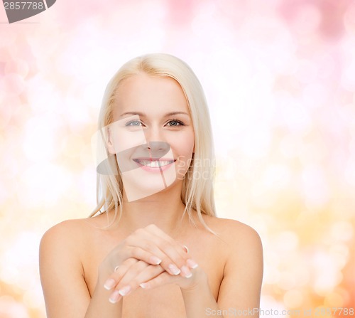 Image of face and hands of beautiful woman