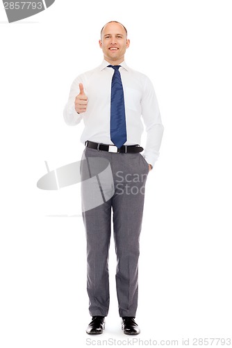 Image of smiling businessman showing thumbs up