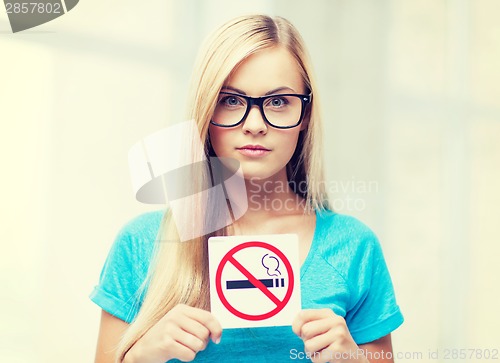 Image of woman with smoking restriction sign