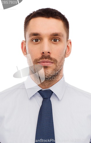 Image of portrait of serious businessman