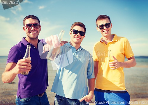 Image of group of male friends with bottles of beer