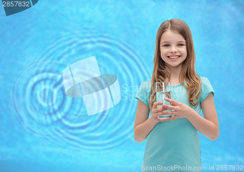 Image of smiling little girl with glass of water