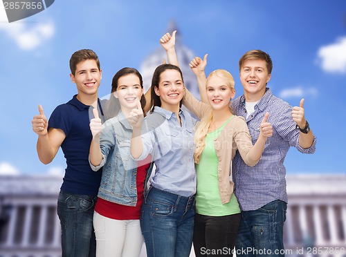 Image of group of smiling students showing thumbs up