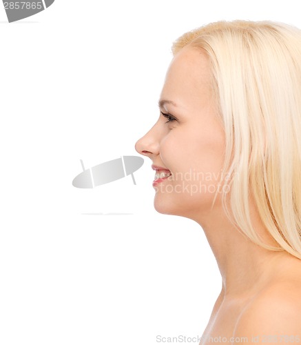 Image of profile portrait of smiling young woman