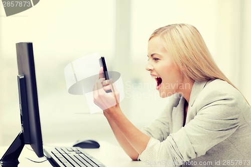 Image of angry woman with phone