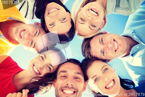 Image of group of teenagers looking down