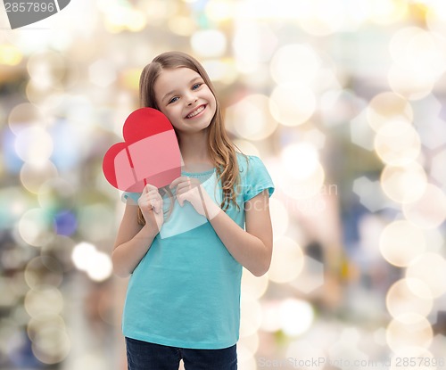 Image of smiling little girl with red heart