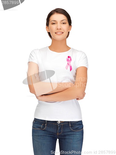 Image of smiling woman with pink cancer awareness ribbon