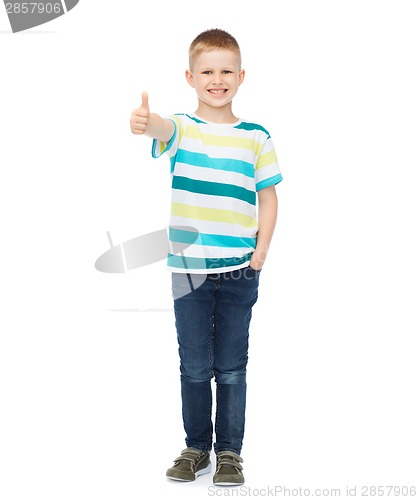 Image of little boy in casual clothes showing thumbs up