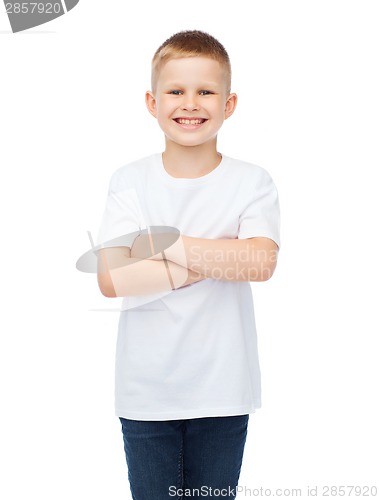 Image of little boy in white t-shirt with arms crossed