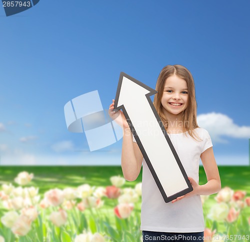 Image of smiling little girl with blank arrow pointing up