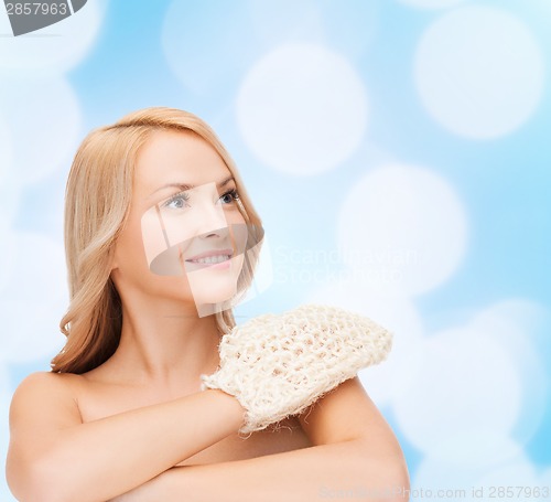 Image of smiling woman with exfoliation glove