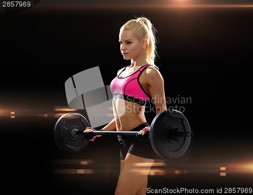 Image of sporty woman exercising with barbell