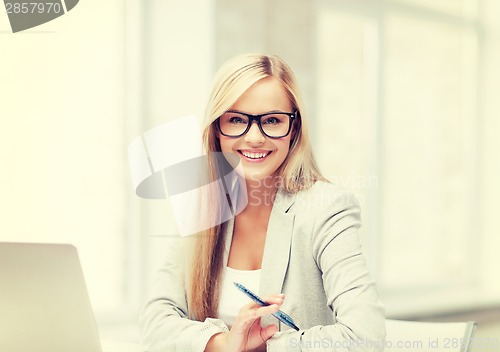 Image of businesswoman with pen