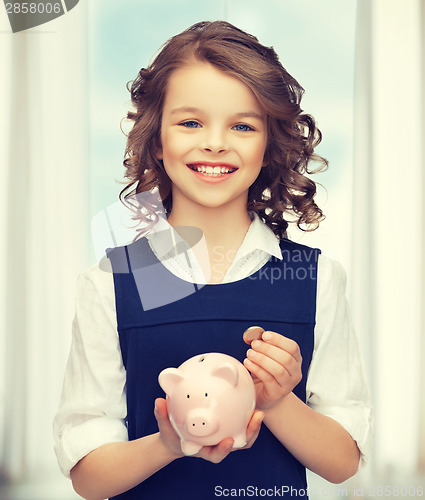 Image of girl with piggy bank