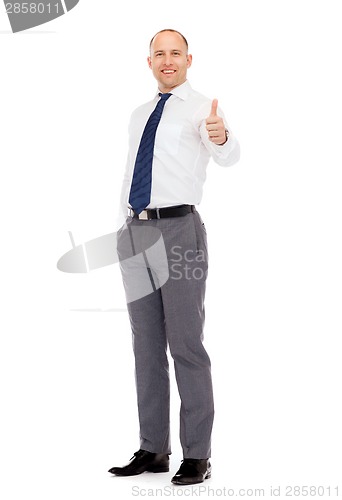 Image of smiling businessman showing thumbs up
