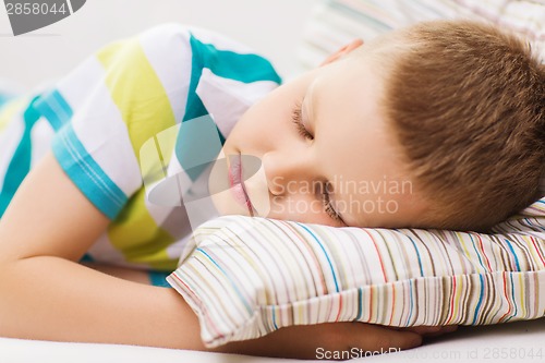 Image of little boy sleeping at home