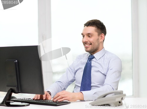 Image of smiling businessman or student with computer