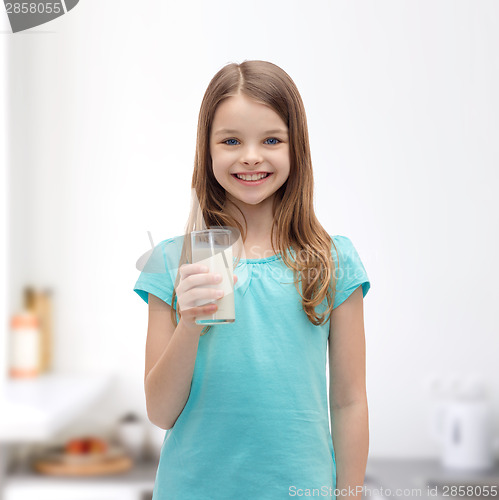 Image of smiling little girl with glass of milk