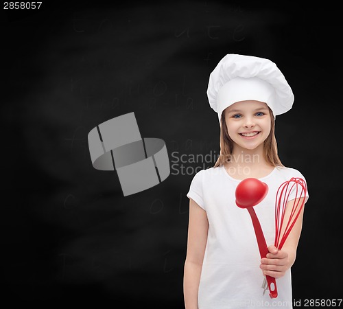 Image of smiling girl in cook hat with ladle and whisk