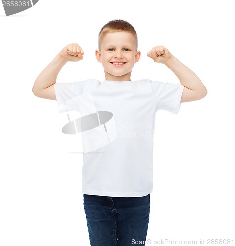 Image of little boy in blank white t-shirt showing muscles