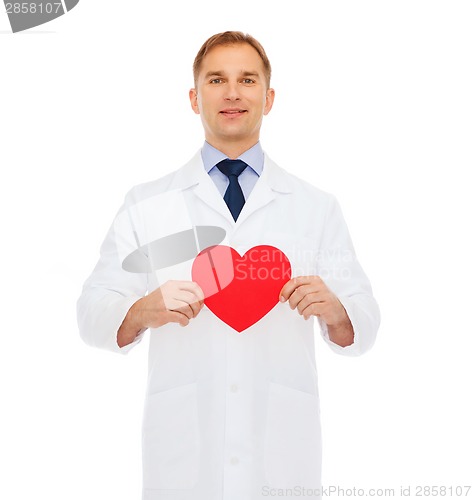 Image of smiling male doctor with red heart