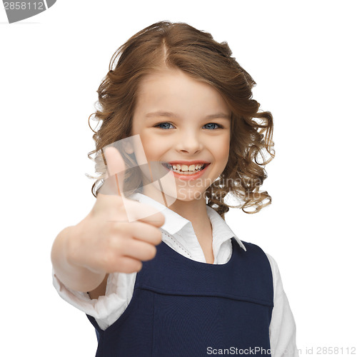 Image of pre-teen girl showing thumbs up