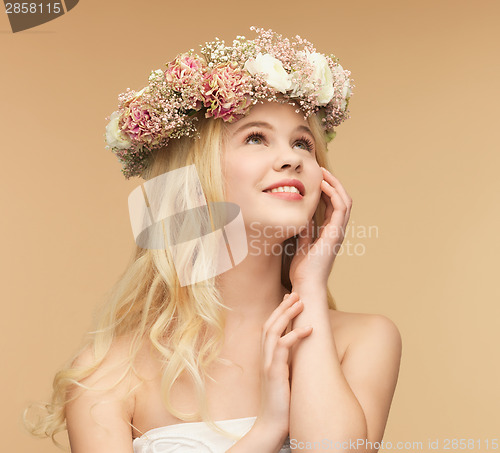 Image of woman wearing wreath of flowers