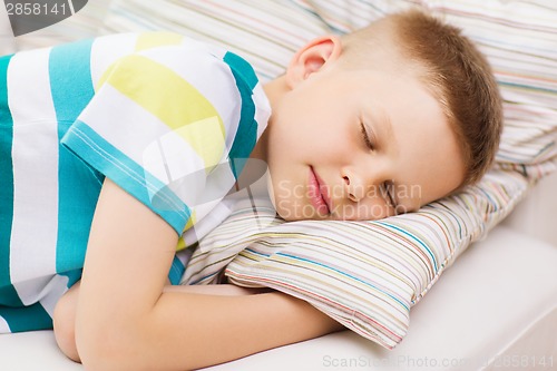 Image of little boy sleeping at home