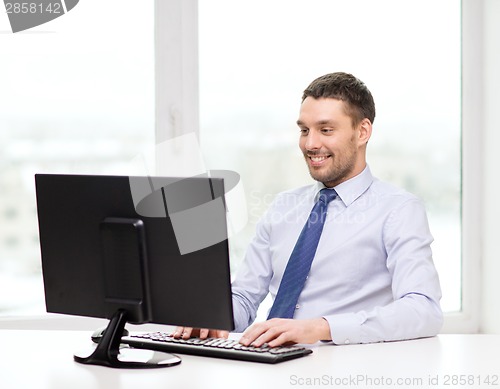 Image of smiling businessman or student with computer