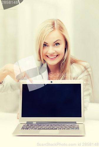 Image of businesswoman with laptop computer