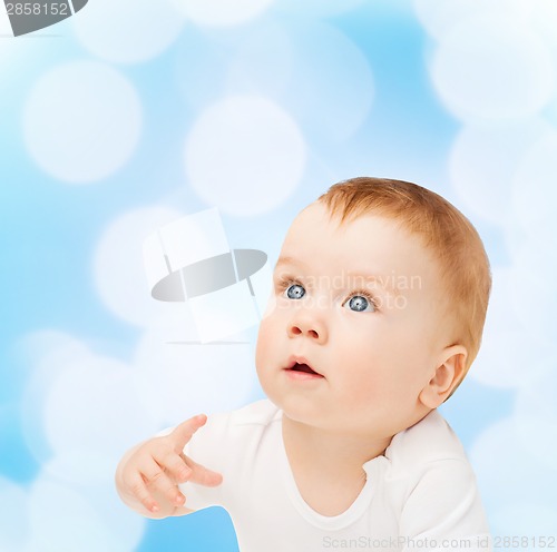 Image of curious baby looking up