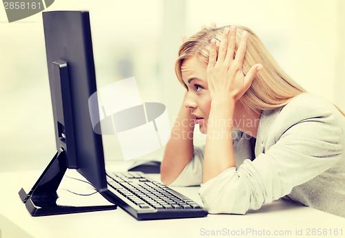 Image of stressed woman with computer