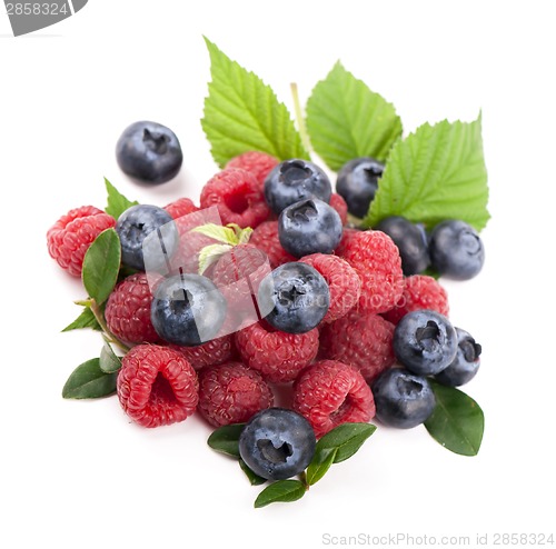 Image of Many blueberries, raspberries. Isolated white