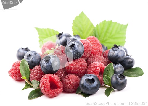 Image of Many blueberries, raspberries. Isolated white