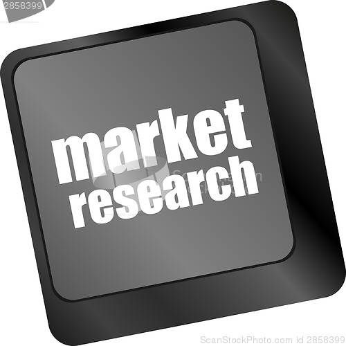 Image of key with market research text on laptop keyboard, business concept