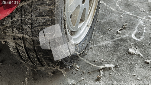 Image of 80’s tire among cobwebs