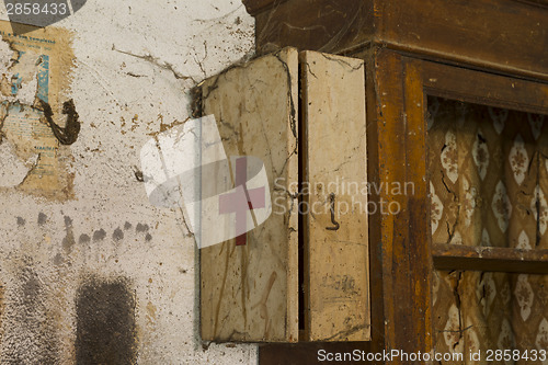 Image of Old first aid kit among the cobwebs