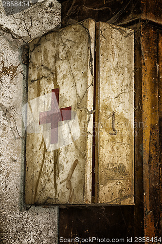Image of Old first aid kit among the cobwebs